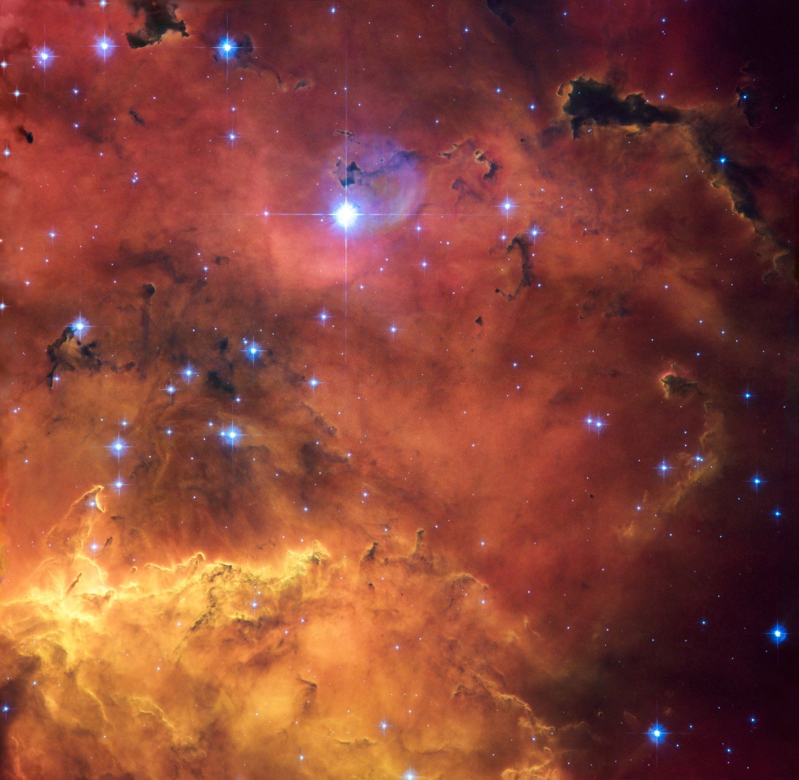 Hubble Space Telescope image of NGC 2467, a star-forming region nicknamed the Skull and Crossbones Nebula