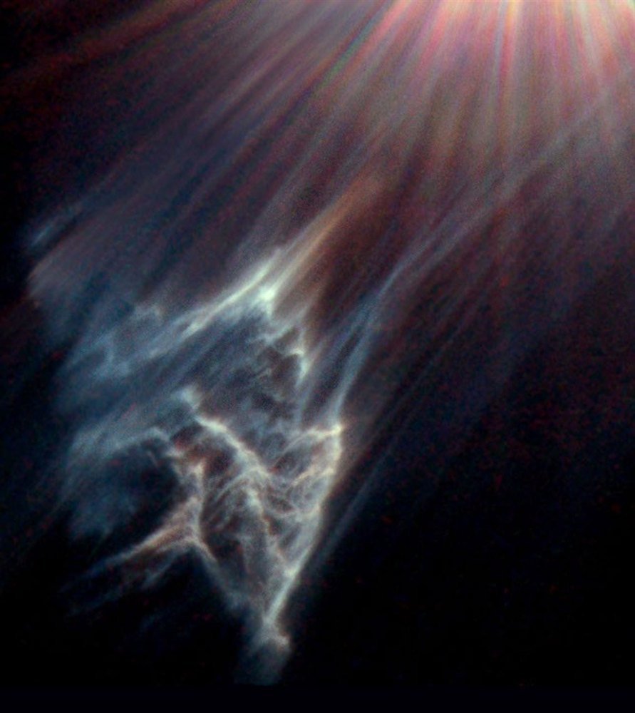 Fine blue-white dust filaments near Merope, photographed by the Hubble Space Telescope