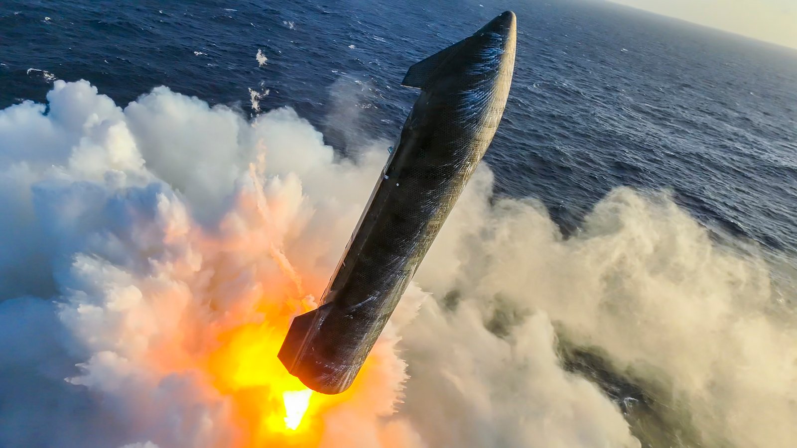 Starship's landing burn during splashdown on Flight 13, seen from above the ocean