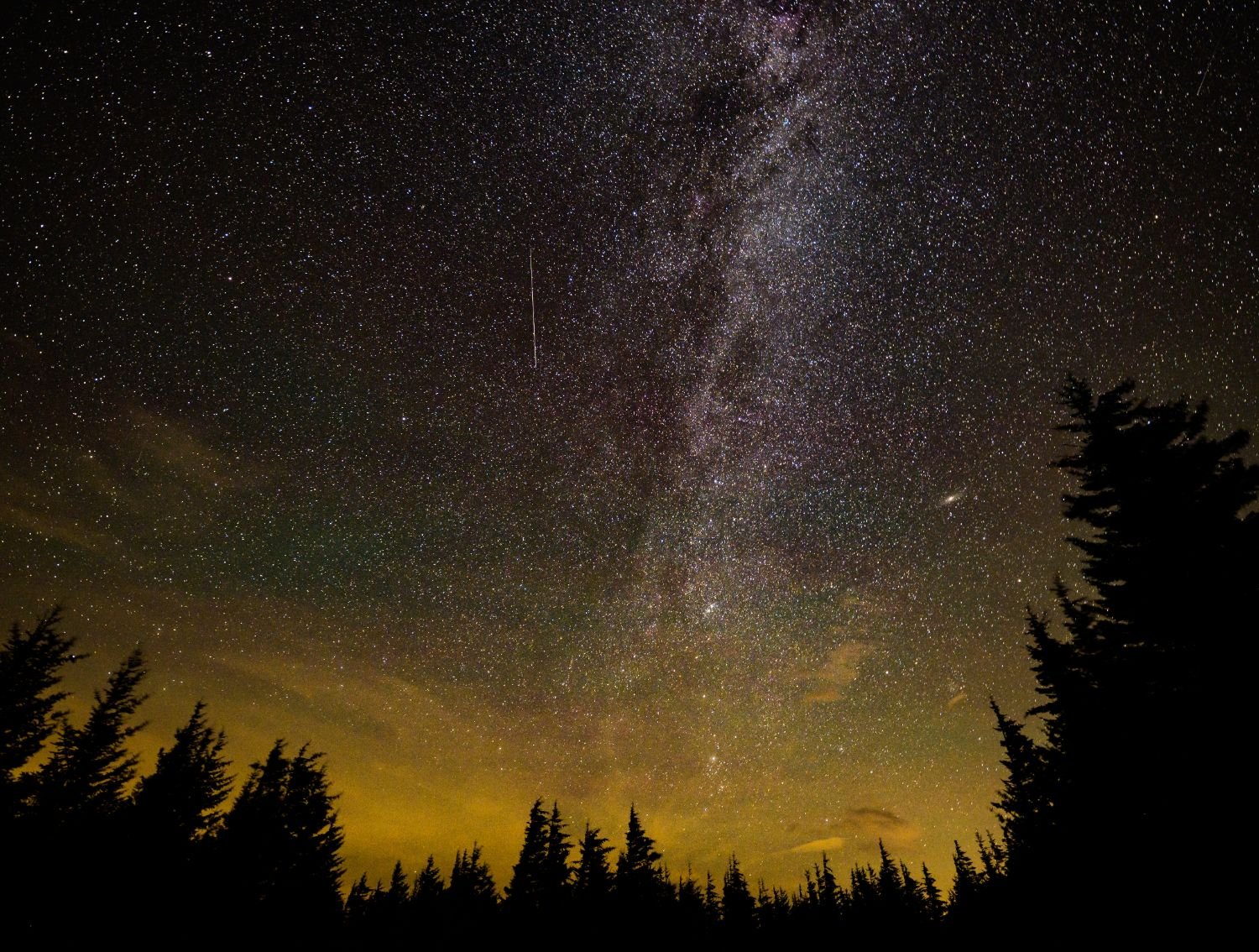 A meteor streaks across the night sky during an annual meteor shower, long-exposure photograph